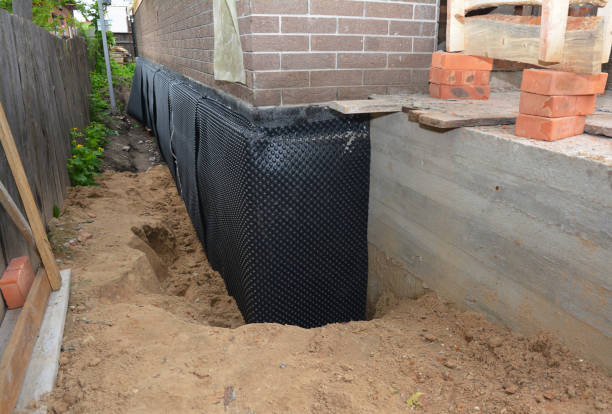 SJ Waterproofing Pros technician performing targeted Exterior Waterproofing assessment in Medinah, IL